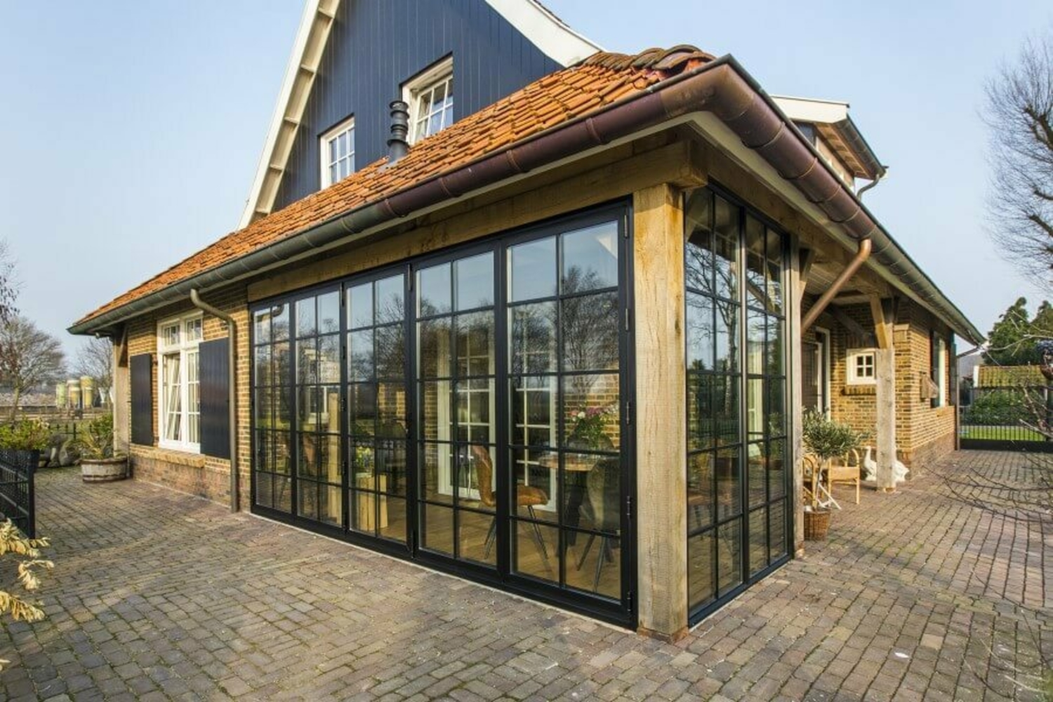 Aanbouw glazen pui achterhoek vragender